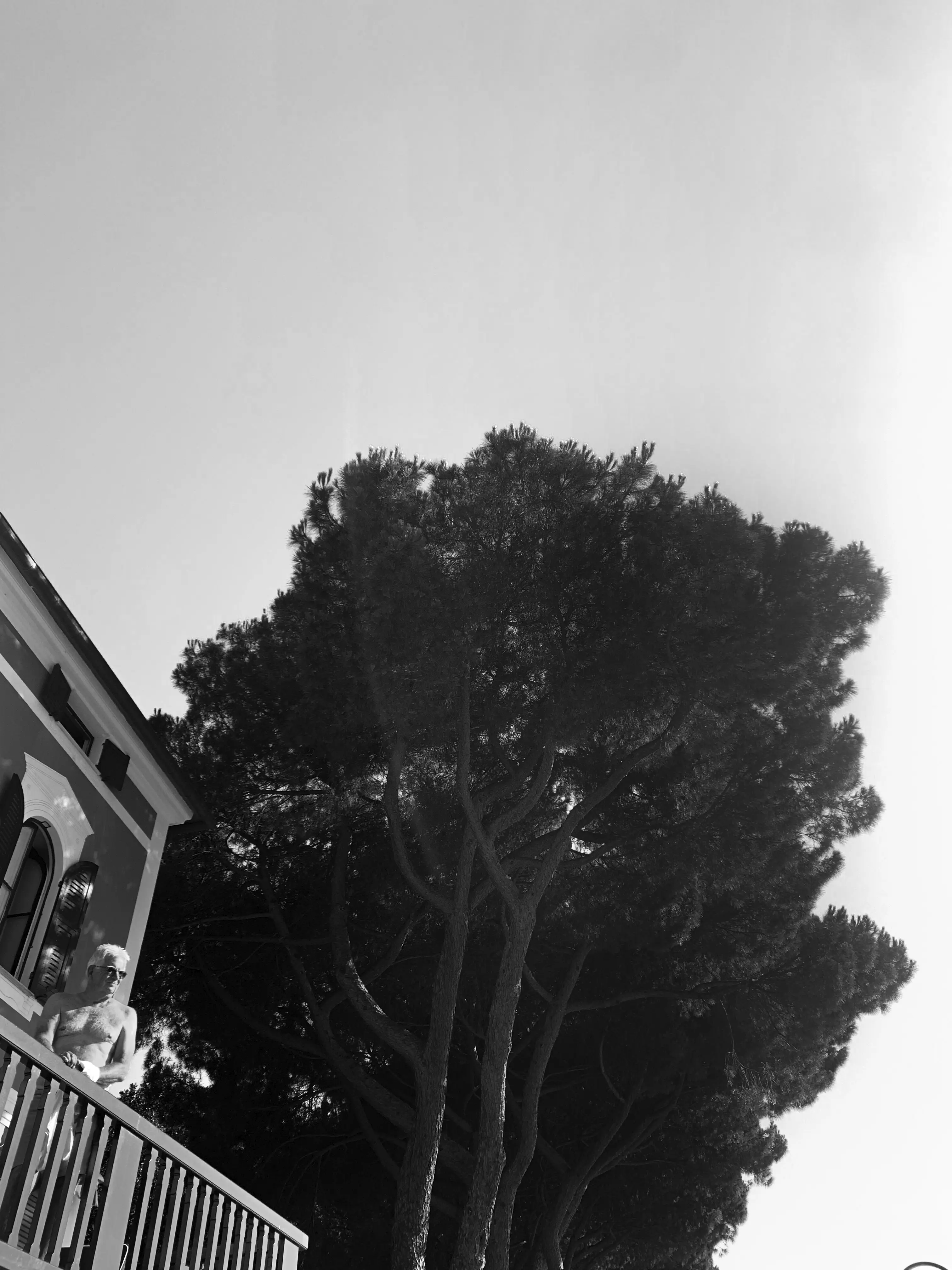 men on a balcoon photography in black and white